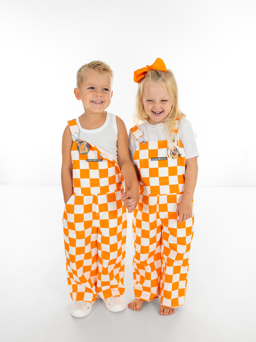 orange and white checkered overall dress Tennessee Volunteers Color:Hydrangea Blue Cinnamon_Rose Model is 59 wearing Viral Green Goddess Chopped